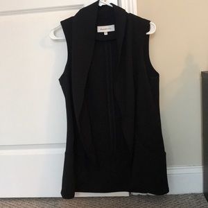 Long waist sleeveless black vest